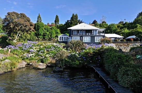 The private jetty and gardens at Black Swan