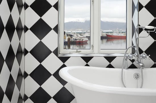 A bathroom overlooking the harbour in Reykjavik