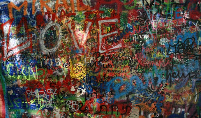 Visit the John Lennon wall in Czech Republic