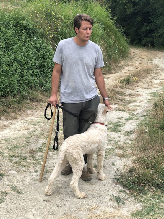 A local truffle hunter and his dog