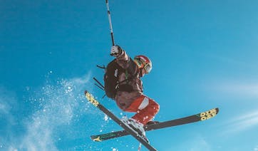 Skiier in the air, luxury holidays USA