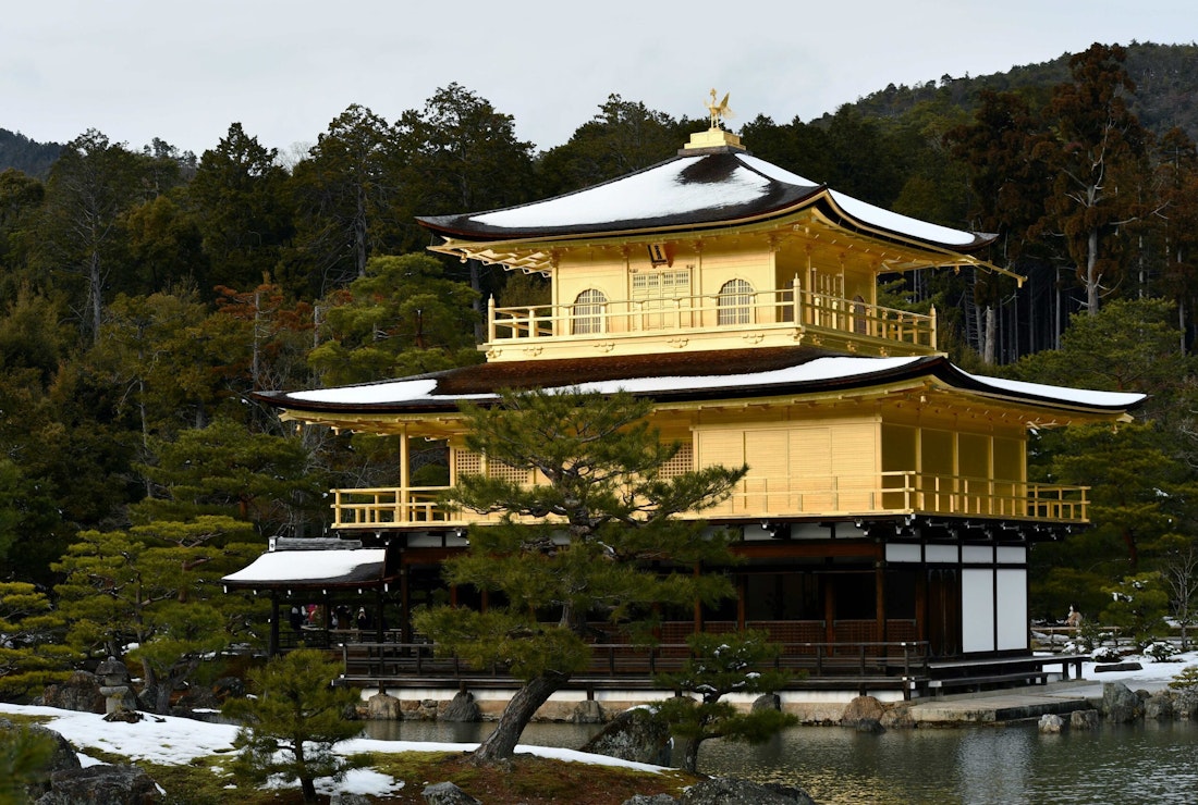 golden temple in the snow in kyoto