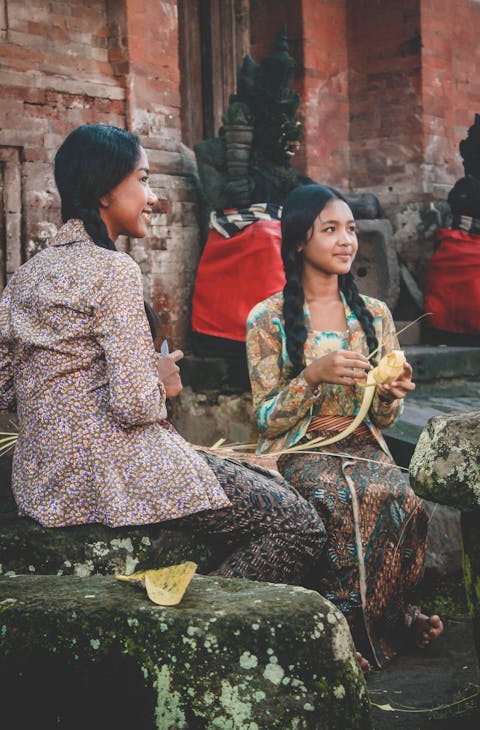 Two ladies weaving in Indonesia
