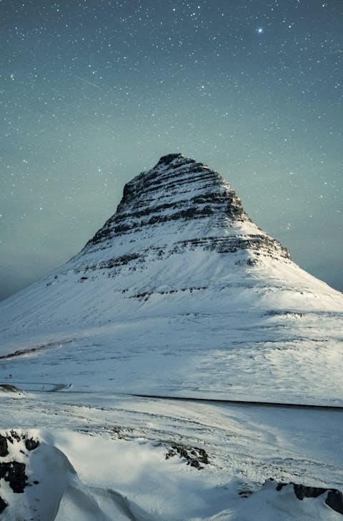 Iceland's winter landscapes with starry sky above