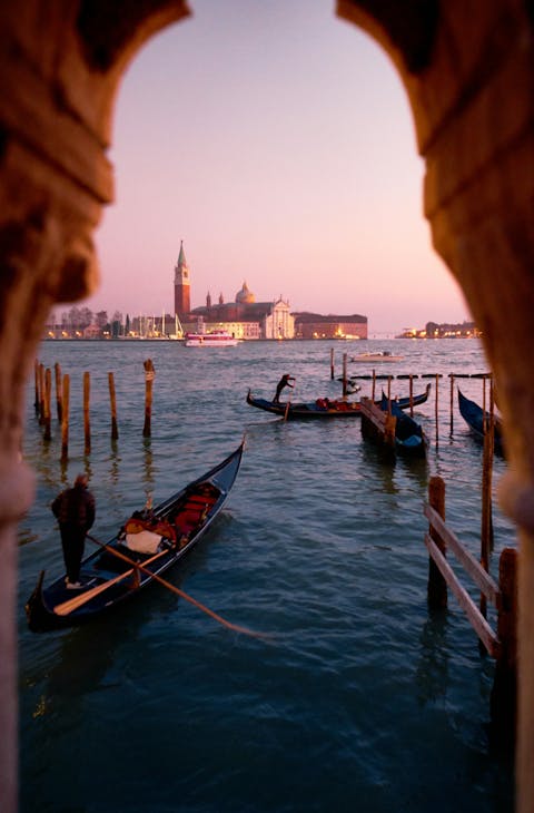 Venice at sunset with gondolas