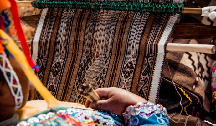A cotton weaver works in Peru, South America