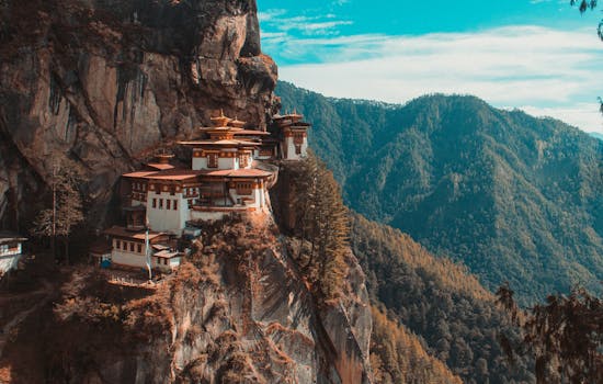 A pagoda on the side of a cliff in Bhutan