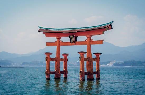 Red arches over water in Japan