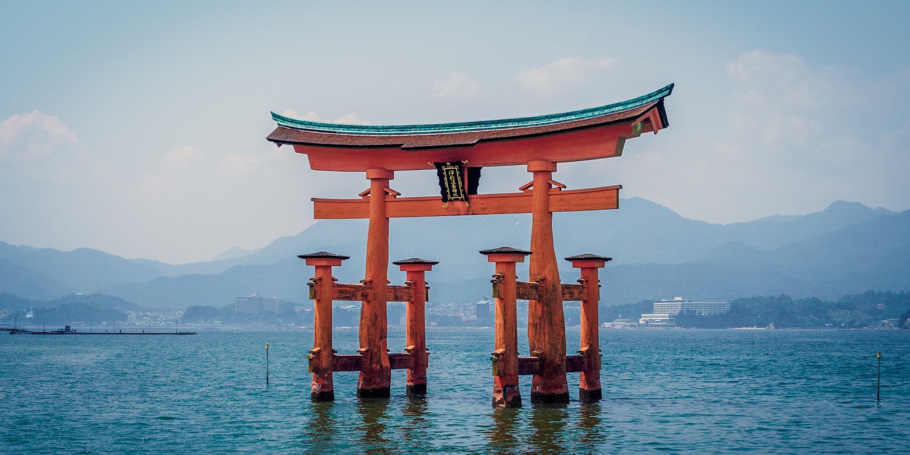Red arches over water in Japan