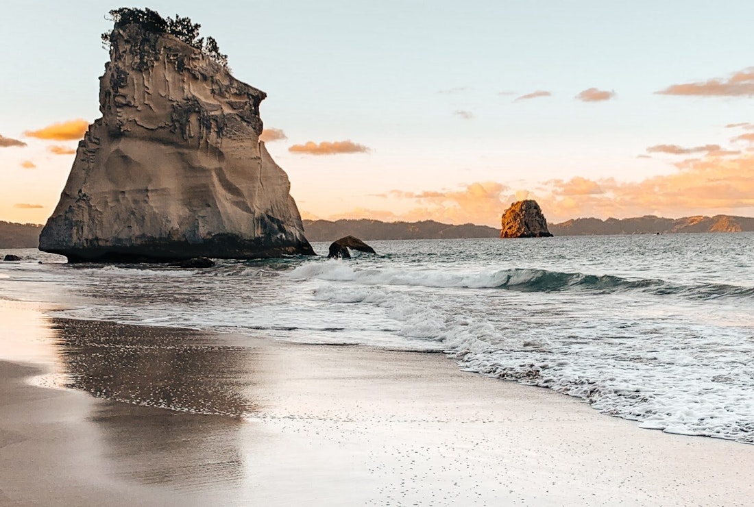 The stunning coastline and sandy beaches of New Zealand - another top travel destination for 2024