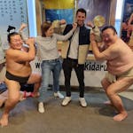Rob O'Leary in Japan with sumo wrestlers