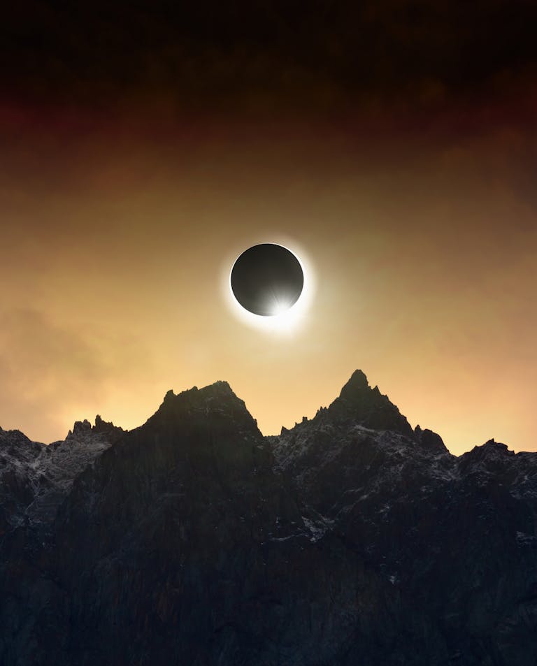 Solar eclipse over the mountains